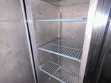 an image of an empty refrigerator with the door open