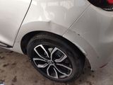 a close up of a white car with a black rim