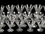a lot of wine glasses that are sitting on a table
