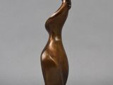bronze sculpture of a woman holding a flower on a marble base