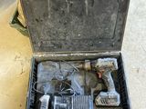 a tool box with tools in it sitting on the floor