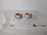 a glass table with silverware and spoons on it