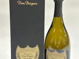 a close up of a bottle of wine next to a box