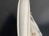 a close up of a pair of white shoes on a table