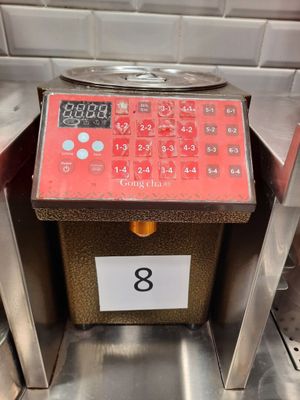 an image of a machine that has a clock on it