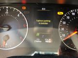 a close up of a car ' s dashboard with a speedometer
