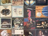 a wall full of various album covers on the wall