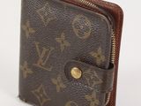 Portefeuille en cuir Louis Vuitton Monogramme avec finitions dorées