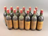 several bottles of wine are lined up in a row