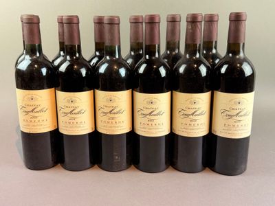 six bottles of wine lined up in a row on a table