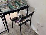 a small table with a lot of books on top of it