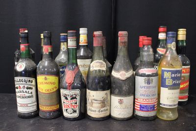 many bottles of alcohol lined up on a table