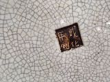 a plate with a cracky design on it on a table