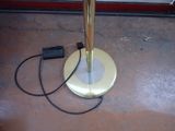 a lamp that is sitting on the floor next to a window