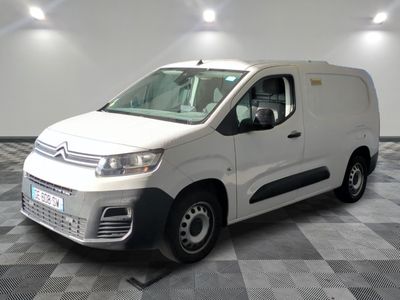 the white van is parked in a clean room with checkered floor