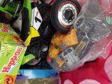 a pile of assorted toys in a plastic bag