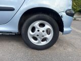 a blue car that has a flat tire on it