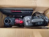 a box with a vacuum and other items inside of it
