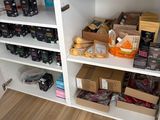 a pantry with a lot of food on the shelves