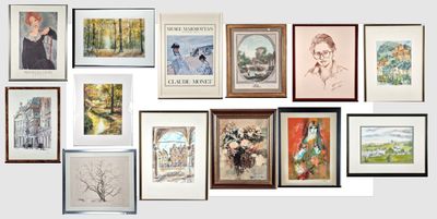 many framed pictures on the wall of this room