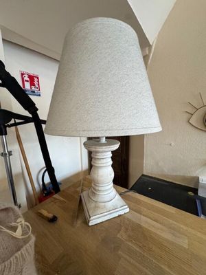 a lamp that is sitting on a table in a room