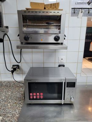 a toaster oven sitting on top of a counter in a kitchen
