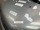a close up of a car with a sticker on the hood