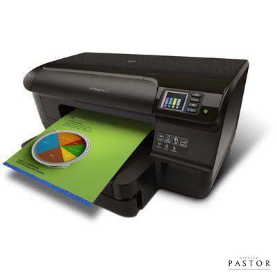 a printer that is sitting next to a piece of paper