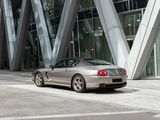 a silver sports car parked in front of a building
