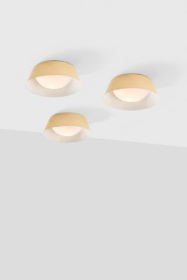 three light fixtures on a ceiling with a white background