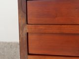 a close up of a wooden table with a drawer on top of it
