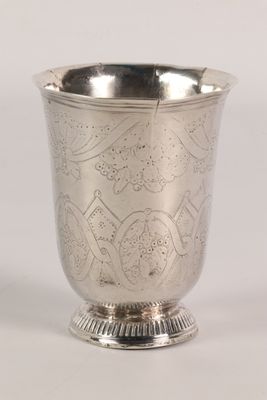 an image of a silver cup sitting on top of a table