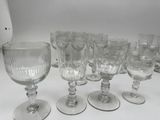a lot of empty wine glasses sitting on a table