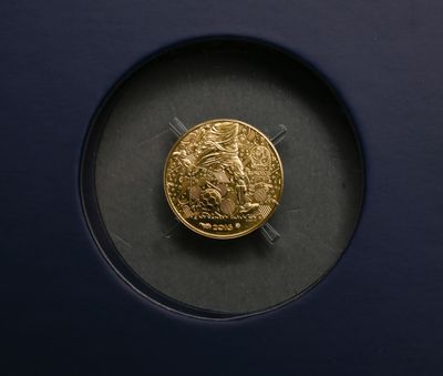 an image of a gold coin in a glass case