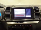 a picture of a car dashboard with a monitor in it