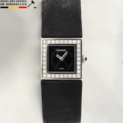 an image of a black watch with diamonds on the face
