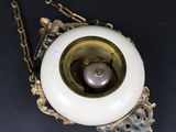 an image of a white and gold pendant with a pearl