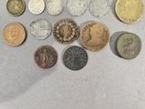 a lot of coins that are on the table