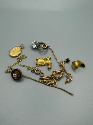 a close up of a bunch of jewelry on a table