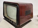 an old television sitting on top of a table