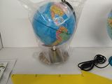 two globes that are sitting on a table