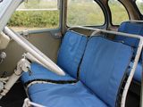 a blue seat in the back of a small car