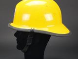 a yellow hard hat on a mannequin head