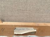 an image of a piece of wood with a piece of paper on it