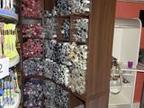 many toothbrushes and toothpaste on display in a store