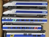 a box full of toy trains sitting on a table