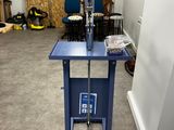 an image of a room with a blue table and chairs