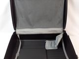 a black suitcase that is open on a white surface