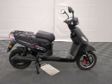 an image of a scooter parked in a garage