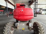a red fire hydrant sitting on top of a truck